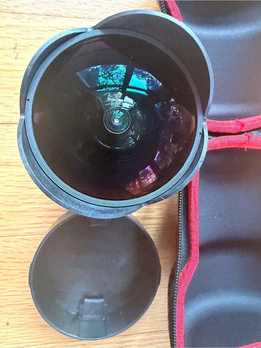 Opteka fish eye camera lens with case and camera lens organization backpack.